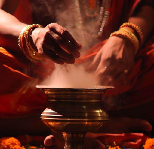 https://bhagya.cards Image of a Yantra being bathed https://bhagya.cards Image of a Yantra being bathed